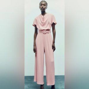 Pleated pant wide leg belted jump suit in pink/beige size medium from Zara.